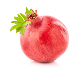 Fresh pomegranate with leaves in closeup