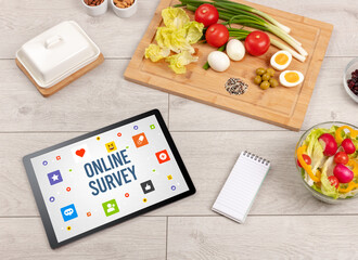 Healthy Tablet Pc compostion with ONLINE SURVEY inscription, Social networking concept