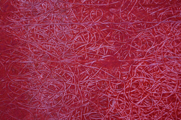 Patterned abstract background, color red with veined interweaving of threads and wire.