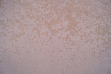 Textured aged background of light brown color with streaks.