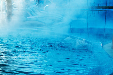 Pool with hot water. Steam over the outdoor pool in winter. Background