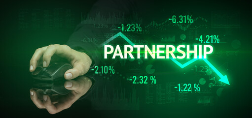 male hand holding wireless peripheral with PARTNERSHIP inscription, modern business concept