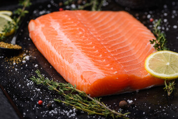 Raw salmon fillet with herbs