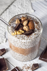 Chia pudding with cocoa, chocolate and nuts in almond milk