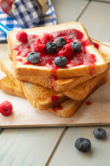 Sandwich toast with berries. French dip sandwich with berries raspberries and blueberries for Breakfast.