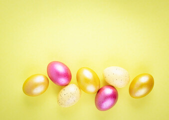 Bright gold and multi-colored colored eggs on a yellow background. Easter theme, holiday. Happy easter card with copy space for text in minimalist easter style.
Yellow, gold. Happy Easter