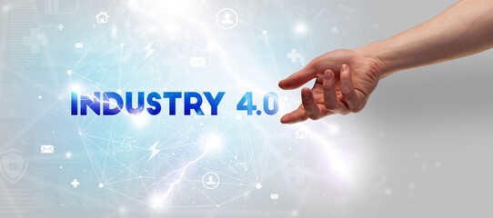 Hand pointing at INDUSTRY 4.0 inscription, modern technology concept