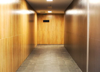 Corridor interior, rooms with wooden walls.