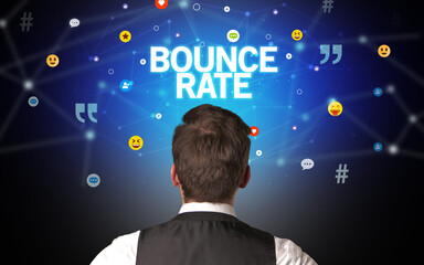 Rear view of a businessman with BOUNCE RATE inscription, social networking concept