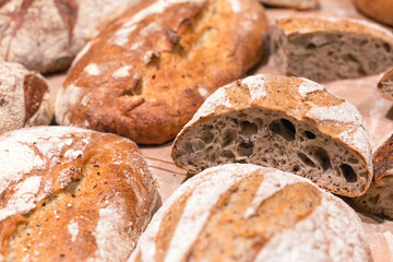 Several loaves of bread on the shelf of the store.