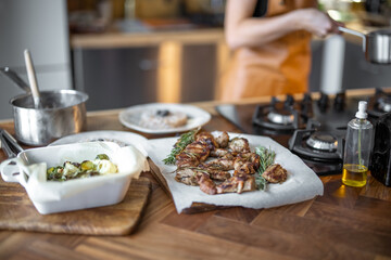 Woman cooking buckwheat in a cooking pan