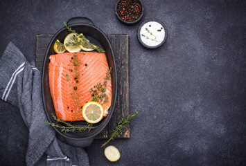 Raw salmon fillet with herbs