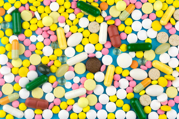 The background is formed with colored pills.
