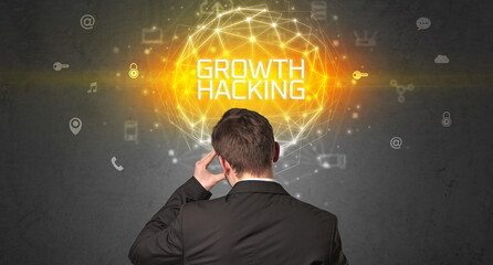 Rear view of a businessman with GROWTH HACKING inscription, online security concept