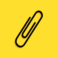 Black Paper clip icon isolated on yellow background. Long shadow style. Vector.