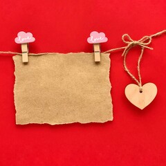Valentines day mockup. Craft paper on the rope, wooden heart.