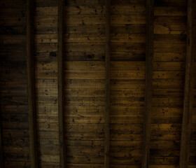 old dark wood ceiling in panels