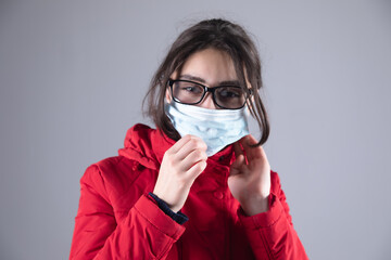 woman with glasses with medical mask