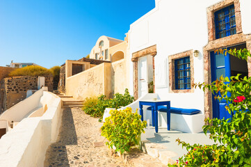 Fototapeta na wymiar Traditional greek white architecture with blue doors and windows. Santorini island, Greece.