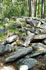 Fototapeta na wymiar Stones on the island lake turgoyak in russia ural