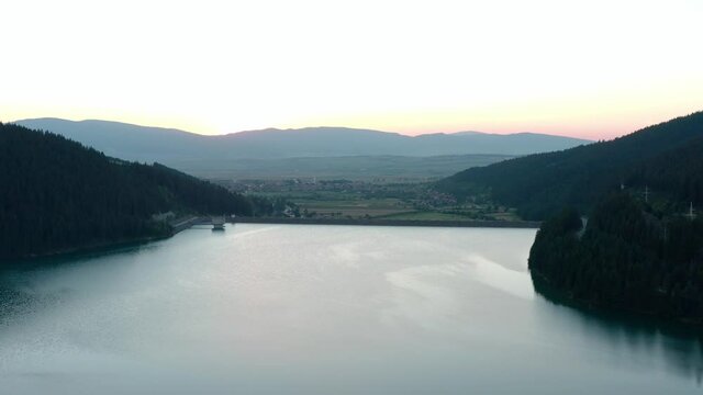 Calm Water In Frumoasa Dam During Beautiful Sunset In Romania. - aerial