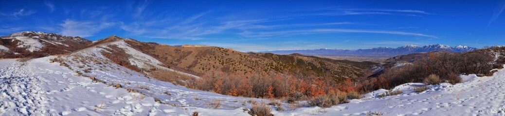 Winter Landscape panorama Oquirrh and Wasatch mountain views from Yellow Fork Canyon County Park Rose Canyon rim hiking trail by Rio Tinto Bingham Copper Mine, Utah. United States.