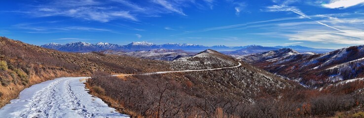 Winter Landscape panorama Oquirrh and Wasatch mountain views from Yellow Fork Canyon County Park Rose Canyon rim hiking trail by Rio Tinto Bingham Copper Mine, Utah. United States.
