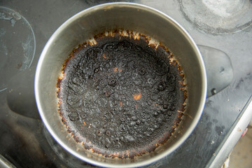 Empty burnt pot with black bottom