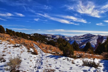 Fototapeta na wymiar Winter Landscape panorama Oquirrh and Wasatch mountain views from Yellow Fork Canyon County Park Rose Canyon rim hiking trail by Rio Tinto Bingham Copper Mine, Utah. United States.