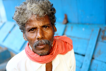 Indian senior man looking at the camera.
