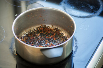 Empty burnt pot with black bottom