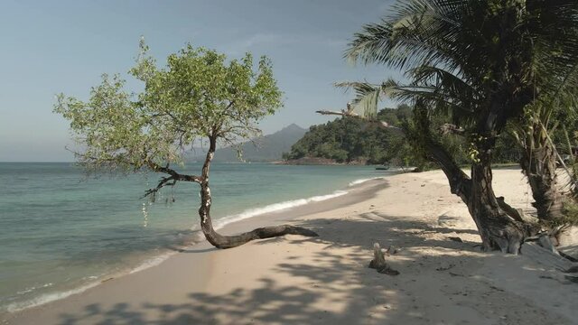 tropical beach with exotic tree, turquoise water and white sand, Kae Bea, Koh Chang