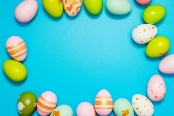 Easter Eggs. Colorful Easter eggs on blue background with copy space