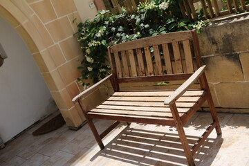 Obraz premium Garden bench and Stephanotis floribunda, Malta
