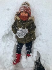 child playing in snow