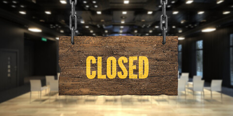 .wooden sign on chains with message CLOSED in front of a conference room background