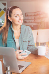 women  Drinking Coffee happily use laptops in cafe