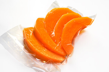 melon slices  vacuum packed sealed for sous vide cooking on white background