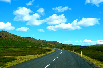 Fototapeta na wymiar The view of the scenic drive on an empty highway on the Ring Road, Iceland during the summer