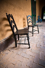 Historic Santa Fe hacienda veranda with two chairs