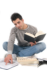 Fototapeta premium young attractive college student with his books studying