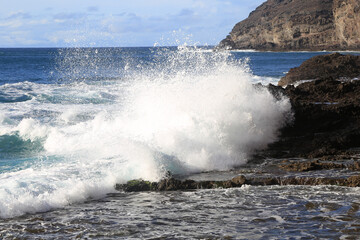 waves crashing on rocks
