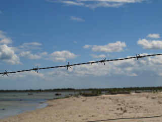 barbed wire on a blue sky