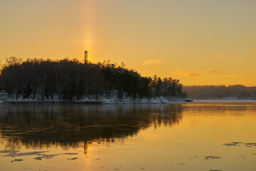 Fototapeta na wymiar The Halo effect on the shores of the Baltic sea in Turku, Finland in winter.