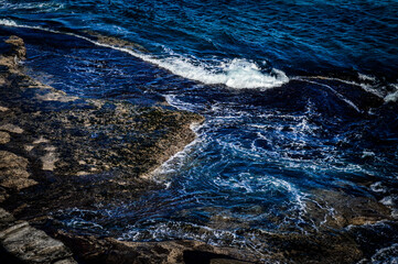 blue ocean waves on the rocks