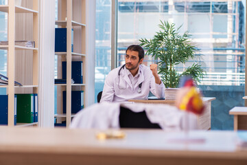Young male doctor cardiologist working in the clinic
