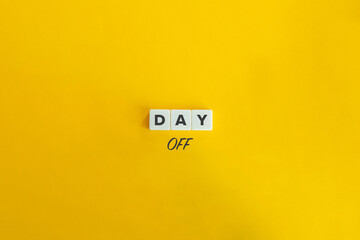 Day Off Concept Banner. Wooden Blocks on Yellow Background.