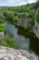Fototapeta na wymiar Buky Canyon summer landscape, Hirskyi Tikych river, Cherkasy Region, Ukraine. People unrecognizable.