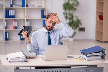 Young male employee wearing virtual glasses at workplace