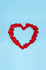 Red decorative hearts laid out in the shape of big heart. Love concept. Wedding frame. Vertical banner.